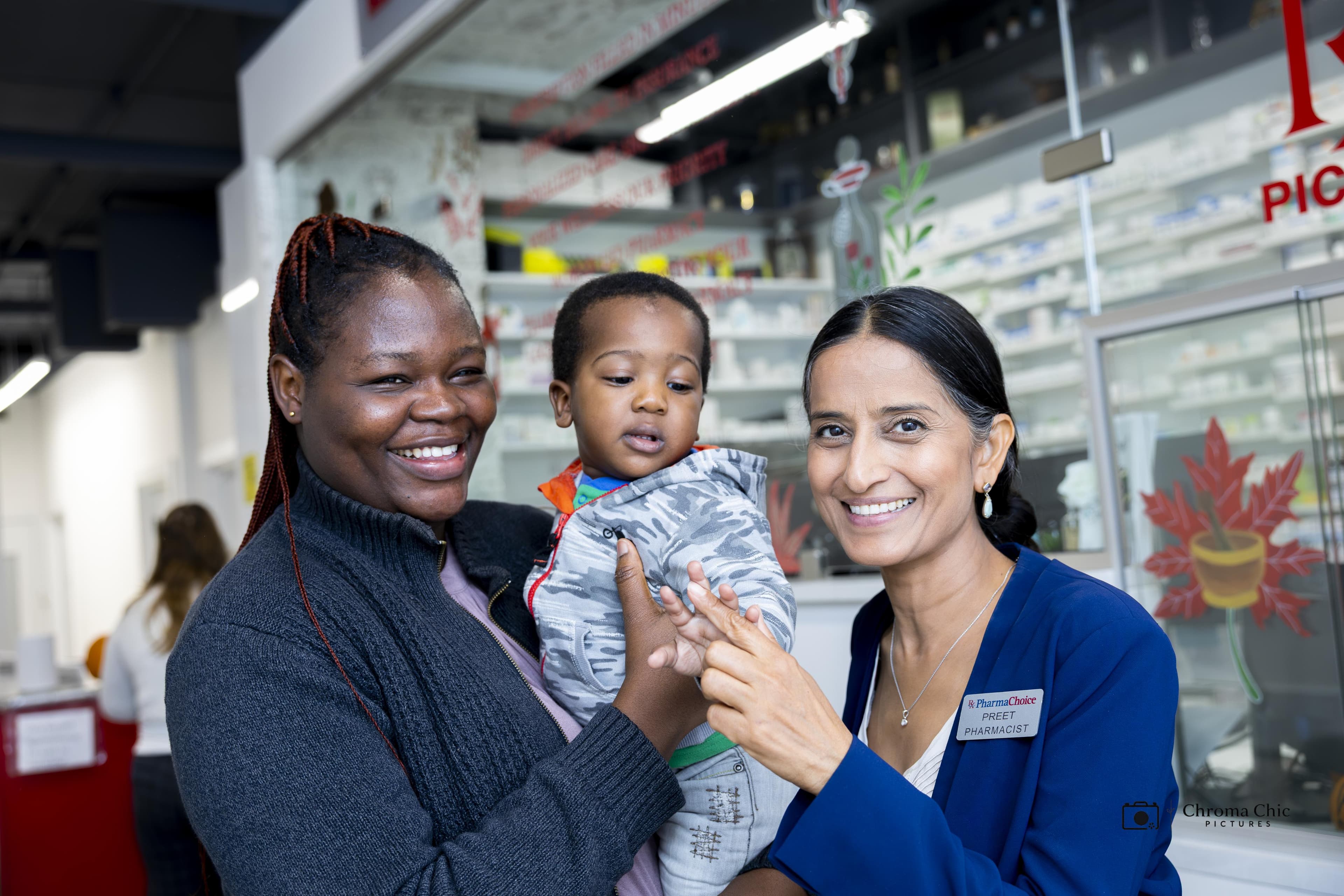 Pharmacist with mother and child